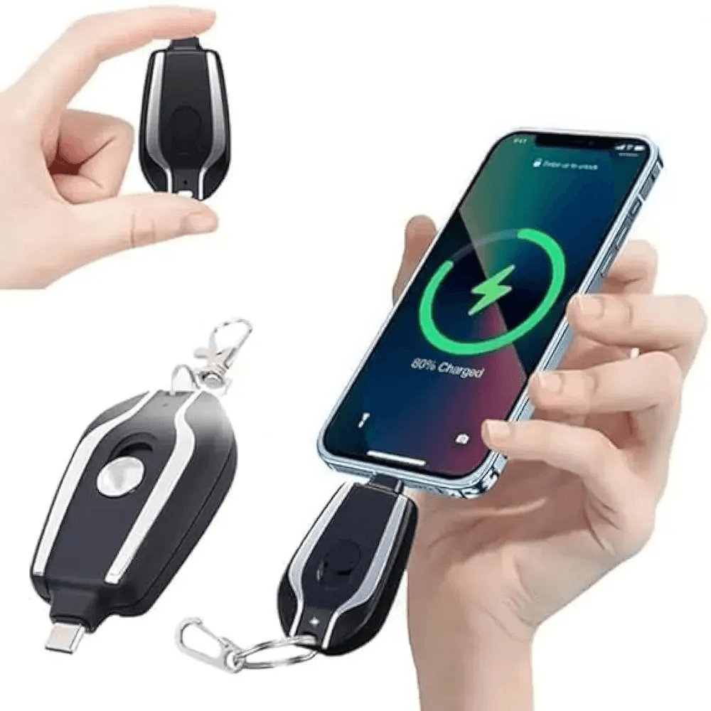 A compact, black keychain power bank for iPhone attached to keys, showcasing its portable and lightweight design.